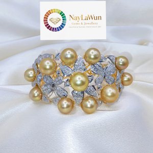The most beautifully crafted gold saltwater pearl and diamond bracelet named Fly To The Golden Sky
