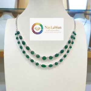 A pair of natural jade and diamond necklaces, both clear and green.
