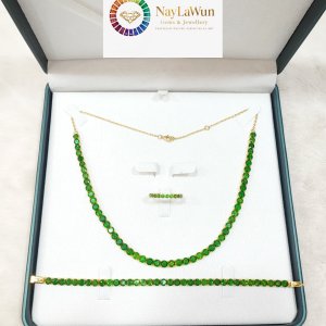 A single row of Moekotte (aka Dioxide) gemstones, which complement the beauty of the sparkling stone, and an Infinity pendant and ring set.