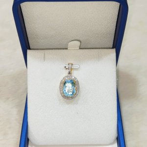 A beautiful Aquamarine pendant surrounded by diamonds.