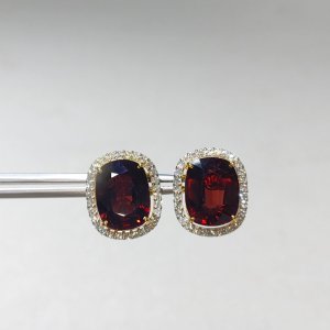 Garnet and diamond earrings, pendant, and ring set.