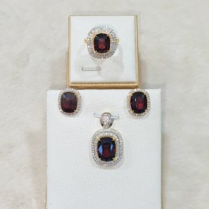 Garnet and diamond earrings, pendant, and ring set.