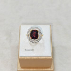 Garnet and diamond earrings, pendant, and ring set.