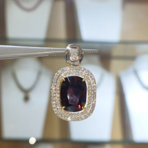 Garnet and diamond earrings, pendant, and ring set.