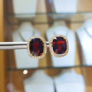 Garnet and diamond earrings, pendant, and ring set.
