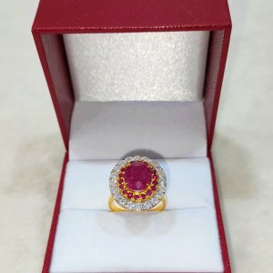 A ring with a newly discovered ruby ​​surrounded by rubies and diamonds.