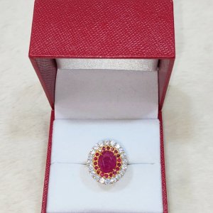 A ring with a newly discovered ruby ​​surrounded by rubies and diamonds.