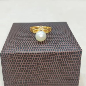 A white saltwater pearl ring that will make you look as cute as a Barbie girl.